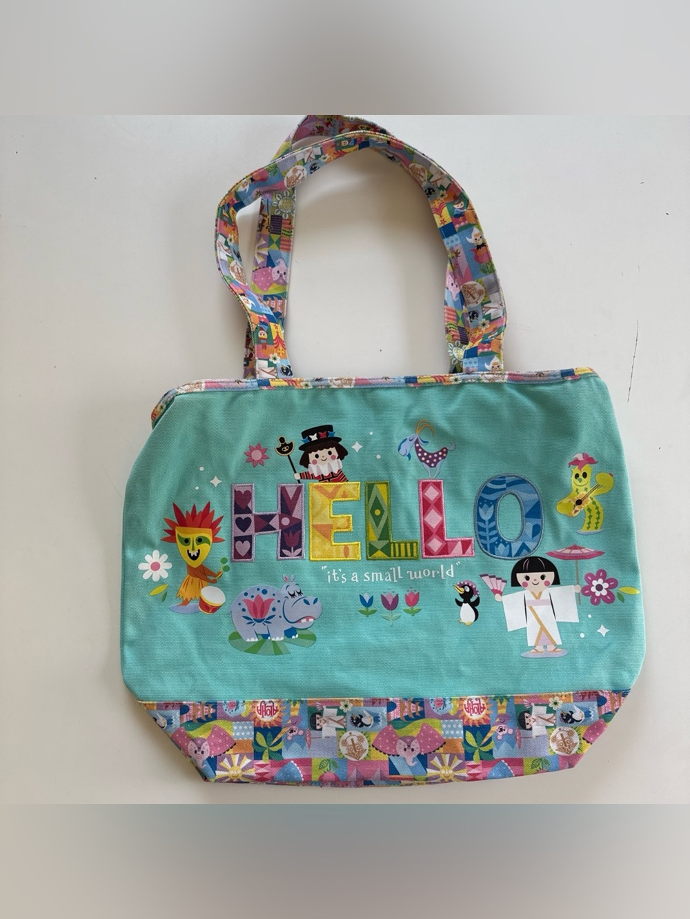 Disney Parks It's a Small World 'Hello' Turquoise Large Canvas Zippered Tote Bag